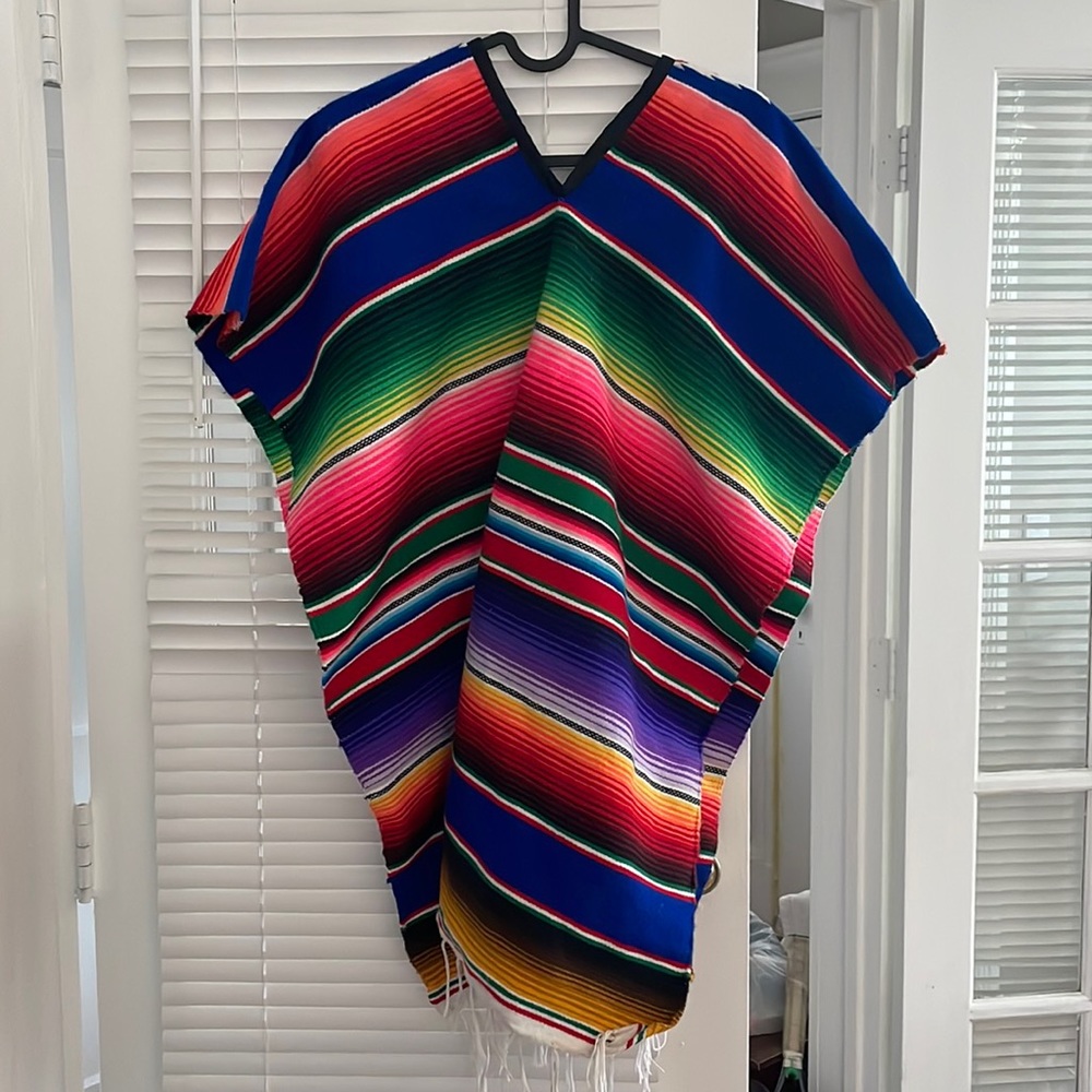 Brand new colorful acrylic poncho made in Mexico. Size can fit small- large